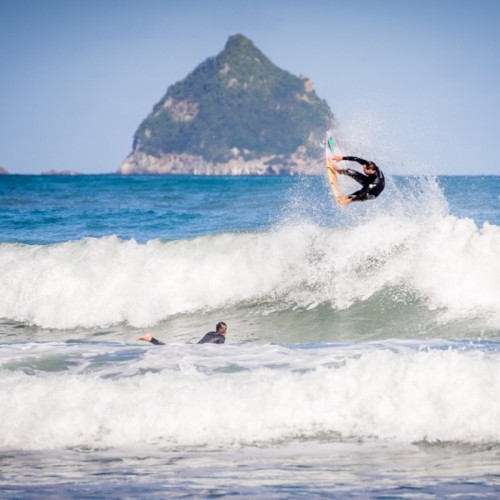 Surfing off the Taranaki Coastline