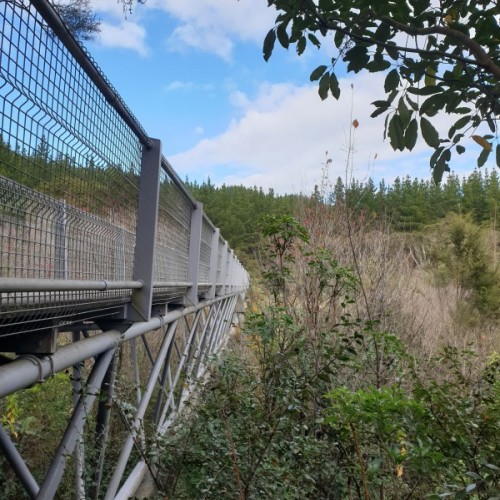 Cross the bridge to continue back along the other side