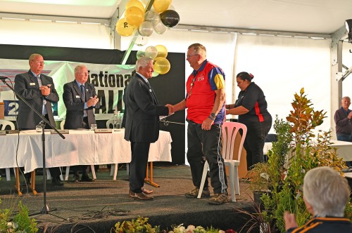 Vice-President Brian Stanley congratulates John Morgan who is this year's recipient of an NZMCA Life Membership for his outstanding contributions to the Association.