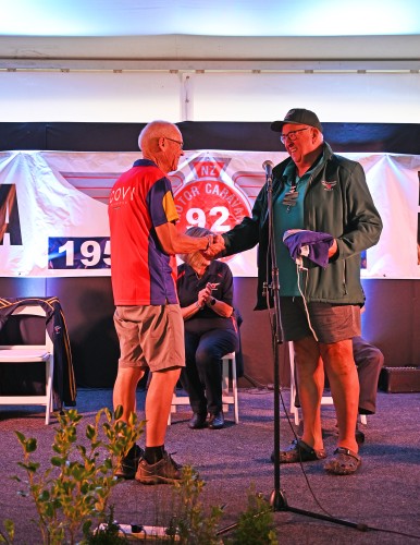 And the flag is passed on to next year's hosts, the Lake Taupo NZMCA Area with 2027 Convenor Les Schwass (rally dates are the last week of February 2027).